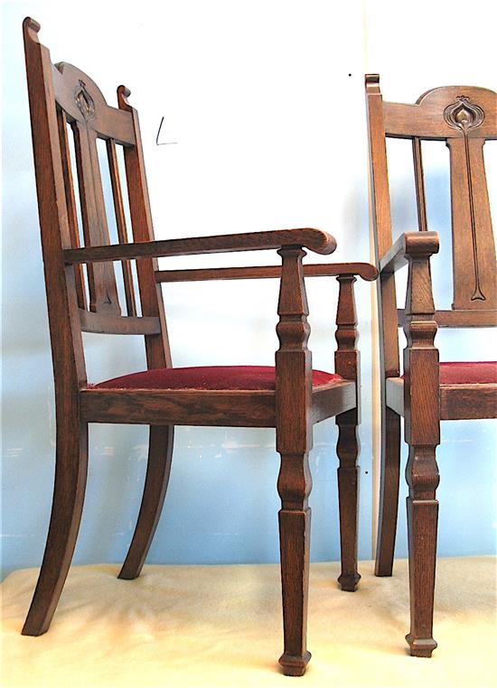 A pair of oak Art Nouveau elbow chairs